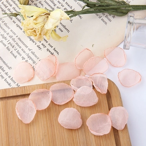 Macro detail of peach mesh flower petals used for DIY romantic fairy jewelry and hair accessories