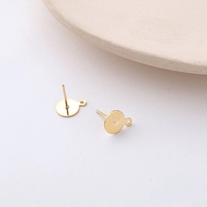 Close-up of 18K gold plated flat stud earring base with side loop for jewelry making