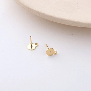 Detail of 18K gold-plated flat stud earring base with side loop for DIY jewelry making