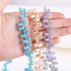 Macro detail of colorful aurora teardrop glass beads for DIY jewelry making and crafts
