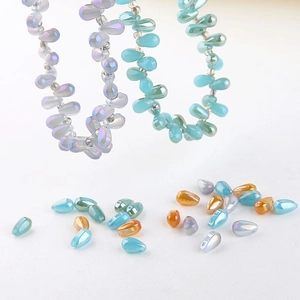 Macro detail of teardrop glass beads with AB rainbow coating for DIY jewelry making