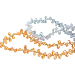 Iridescent teardrop glass beads in metallic gold and blue for DIY jewelry crafting
