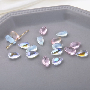 Macro shot of iridescent teardrop crystal beads with pre-drilled holes for jewelry DIY