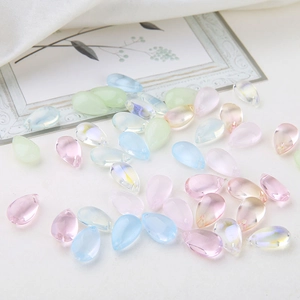 Macro shot of colorful glass teardrop beads for DIY jewelry and earring making