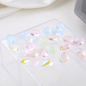 Macro shot of colorful transparent teardrop crystal glass beads for DIY jewelry making