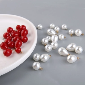 Red and white teardrop and round pearl charms with metal loops for DIY jewelry making