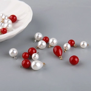 Assorted red and white faux pearl pendants in round and teardrop shapes for DIY jewelry