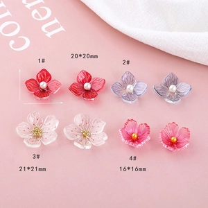 Close-up of DIY acrylic cherry blossom beads in assorted colors and sizes for jewelry