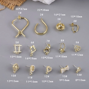 Detailed view of gold geometric alloy jewelry charms and DIY earring findings with crystals