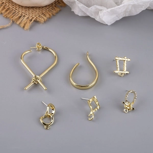 6-piece gold-tone earring set featuring minimalist geometric hoops, ear cuffs, and studs