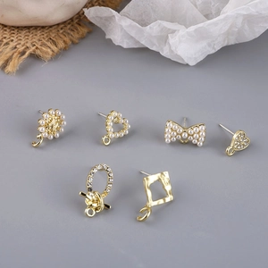 Golden alloy heart and bow earrings with faux pearls and rhinestones for DIY jewelry making