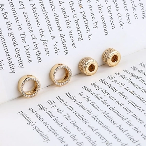 Detail of 14K gold plated bow ring charms with zircon inlay for DIY jewelry design