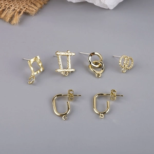 Selection of golden alloy DIY jewelry findings and earring components for handmade crafts
