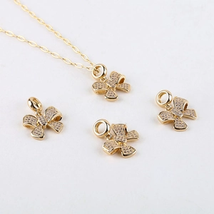 14K gold plated bow pendant with sparkling cubic zirconia on a classic O-chain