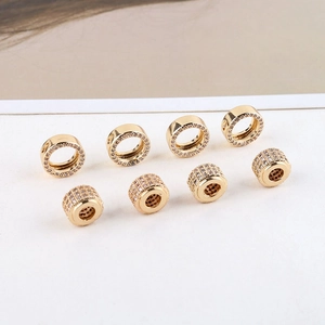 Close-up of 14K gold plated bow pendants and pave cubic zirconia DIY jewelry findings