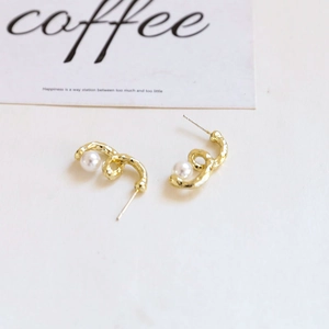 Baroque style gold alloy stud earrings with white pearl in a vintage spiral design