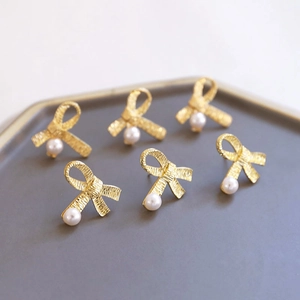 Baroque golden bow stud earrings with white pearls in a 3-pair set for women