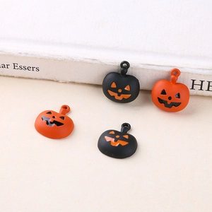 Halloween pumpkin pendant charms in orange and black for DIY jewelry making