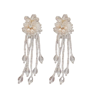 Exaggerated beaded flower tassel earrings with crystal fringe in minimalist white setting
