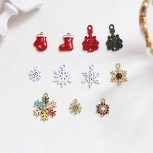 Detailed close-up of festive Christmas alloy charms including socks, gloves, and snowflakes
