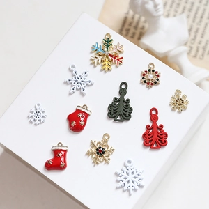DIY Christmas alloy charms set with red stockings and snowflakes on vintage background