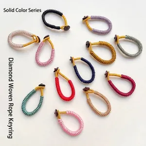 Handmade woven vajra knot keychain ring in various solid colors with wood fastener