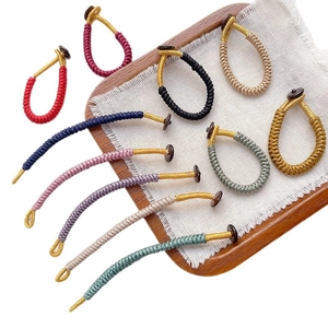 Handmade woven rope knots in multiple colors with metallic threads and round button closures