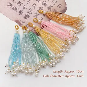 Macro shot of 10cm handmade beaded tassels with colorful seed beads and white imitation pearls