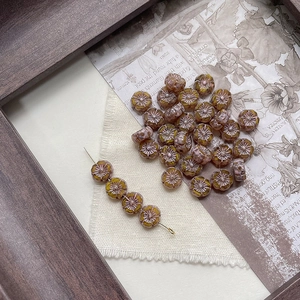 Macro view of vintage Picasso style glass flower beads for DIY jewelry making