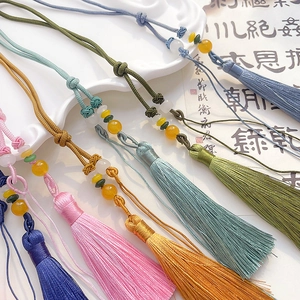 Handmade silk tassels with beads and knots in various colors for DIY fans and decor