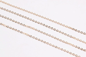 Close-up of gold-plated tassel chains showing detailed links for DIY jewelry making