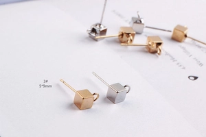 Macro detail of 5x9mm cube stud earring findings with hanging loops for DIY jewelry