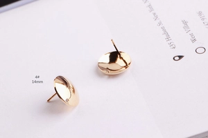 Detailed view of 14mm round gold polished metal earring studs for DIY jewelry making