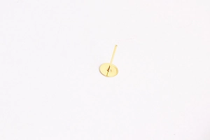 Flat round gold ear stud base for DIY jewelry making displayed on a white background