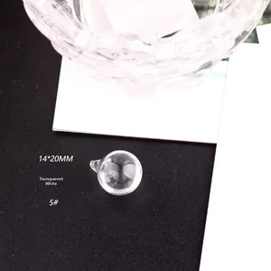Detail shot of a 14x20mm transparent glass orb pendant with a secure metal hook loop