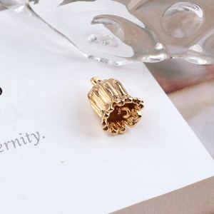 Close-up of 18K gold plated lily of the valley flower pendant for DIY jewelry making