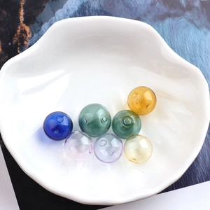 Macro detail of colorful transparent hollow glass balls for DIY jewelry and earrings