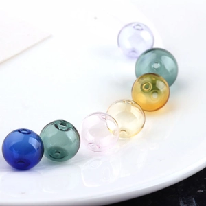 Detailed view of colorful transparent glass beads for DIY jewelry and earring making