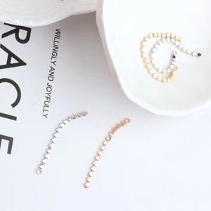 Detailed view of 18K gold plated flat round bead chain for DIY earring tassel jewelry making