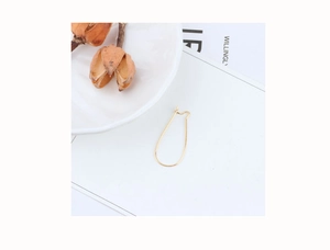 Minimalist gold teardrop earring hook component for DIY jewelry making on white background