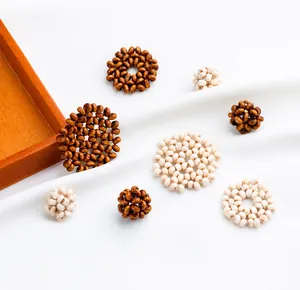 Detail of DIY hand-woven wooden ball pendants for summer jewelry earring crafts