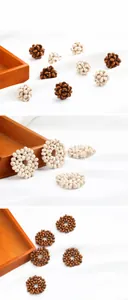Detailed view of handmade woven wood beads in natural and brown tones for DIY jewelry