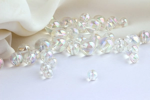 Macro view of rainbow AB coated acrylic beads with holographic shimmer for DIY jewelry