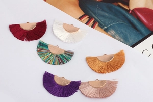 Close-up of semi-circle fan tassel pendants in six colors for DIY earring making