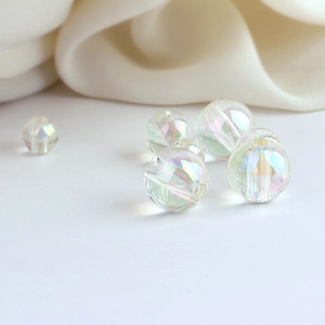 Macro view of iridescent mermaid bubble acrylic beads for DIY handmade jewelry crafts