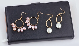 Detail of DIY alloy geometric earrings with irregular pearls and golden branch design