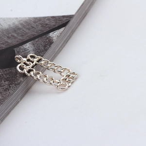 Detailed view of silver rectangular curb chain link charm for DIY jewelry making