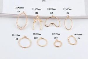 Detailed view of assorted gold alloy branch and geometric pendants for DIY jewelry making