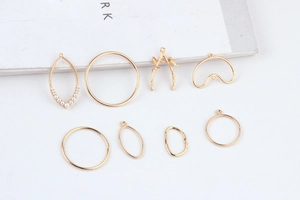 Golden DIY alloy charms in teardrop and branch shapes with pearl accents for jewelry