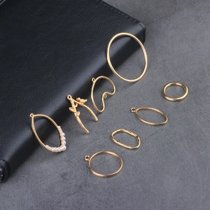 Set of 8 golden alloy jewelry charms with geometric branch shapes and white faux pearls